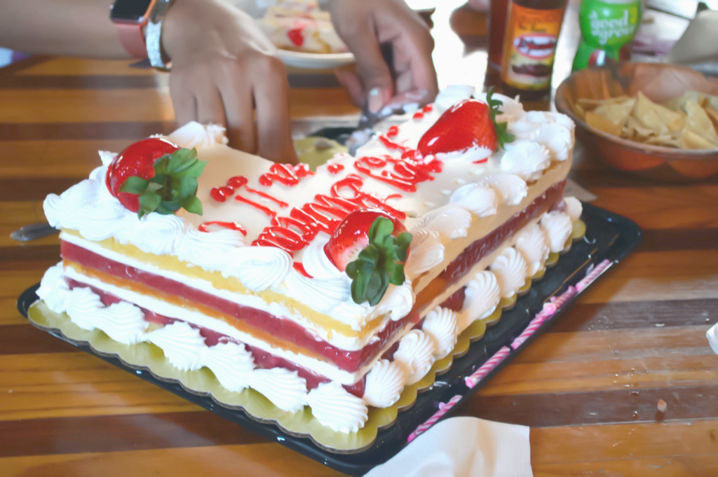 portion controlling the strawberry cake to maintain healthy habits while eating out