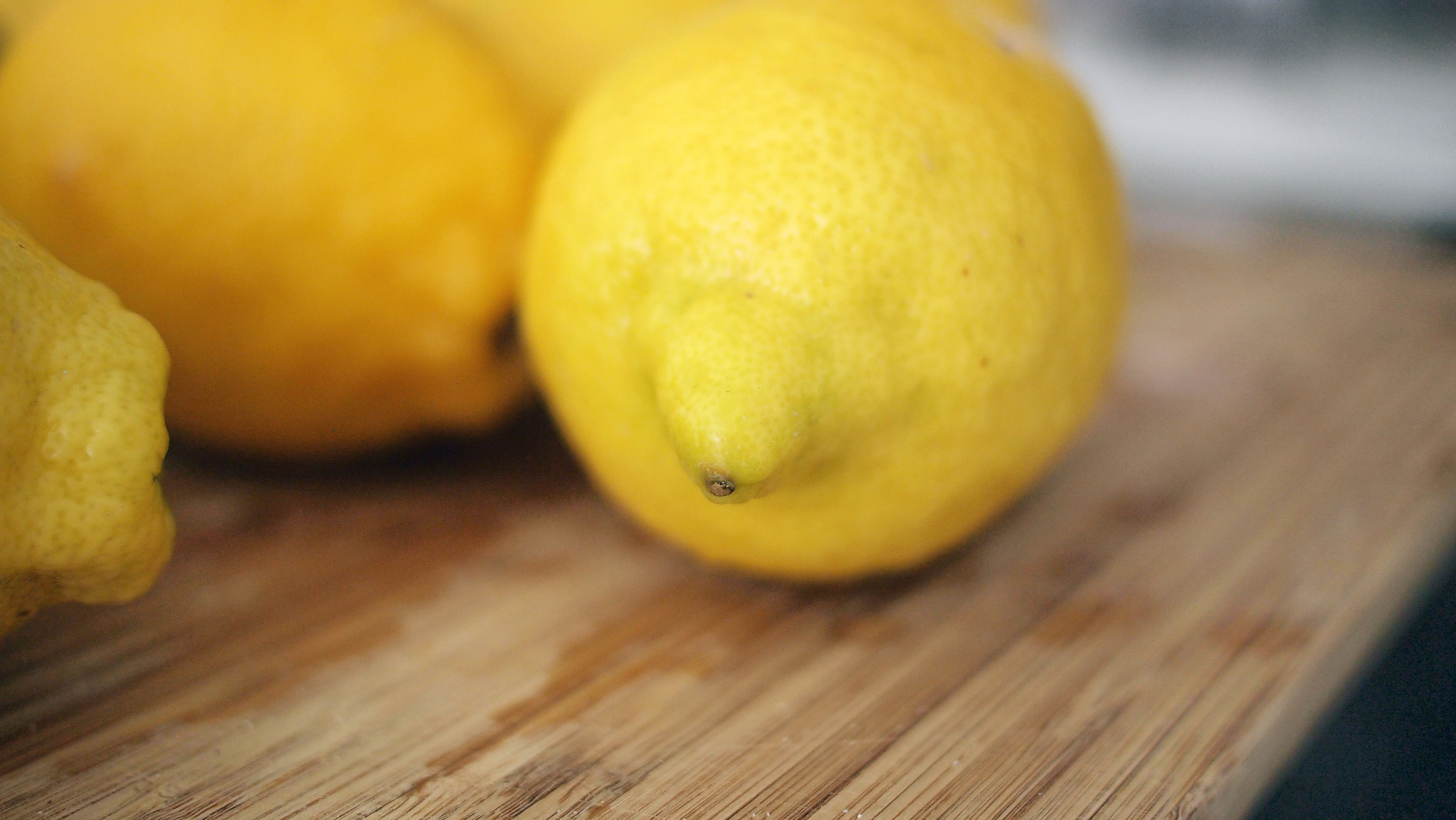 lemons on a cutting board for lemon water