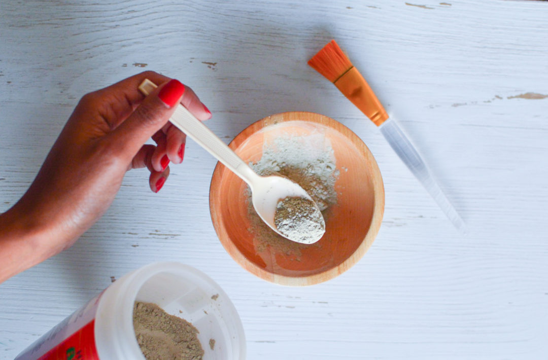 putting aztec healing clay mask into a bowl
